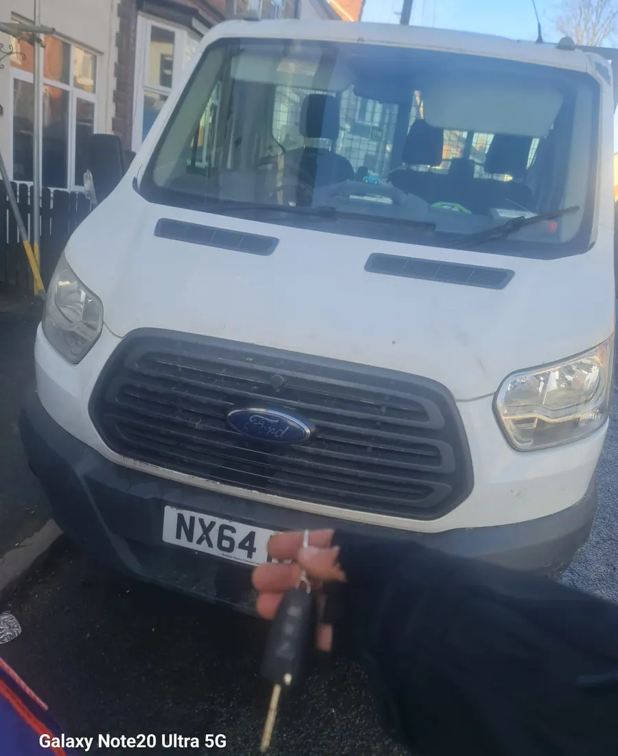 Auto locksmith van and key during a mobile vehicle visit
